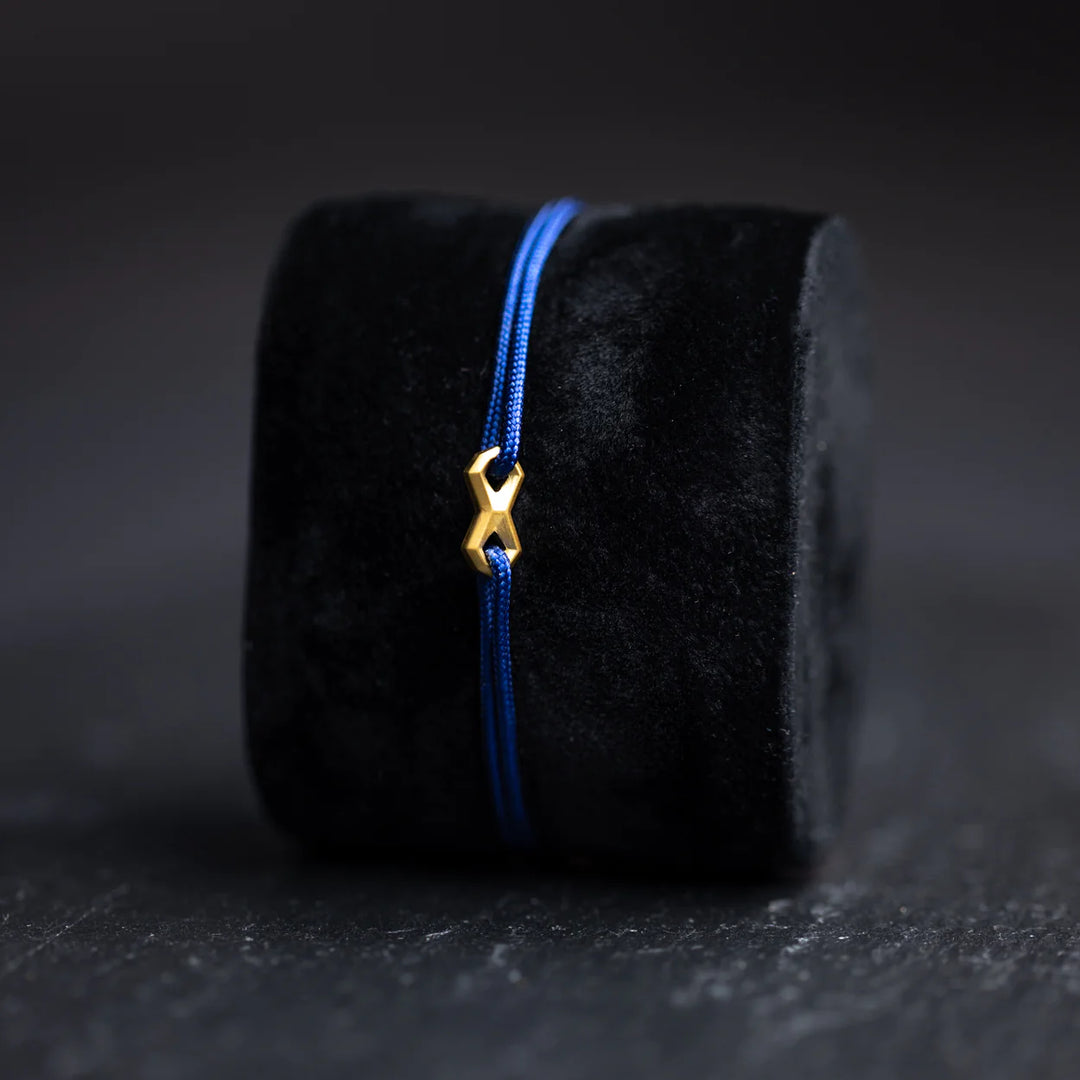 Nylonarmband 1,5 mm, blau, Infinity-Zeichen vergoldet